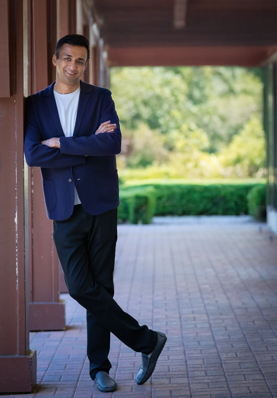 Harsh Singhal standing beside a covered walkway
